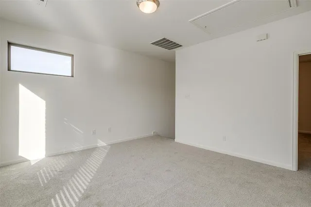 a view of an empty room and entryway