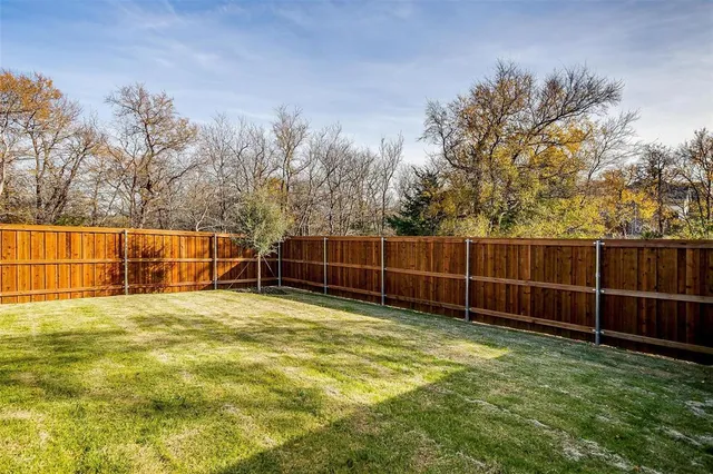 a swimming pool with wooden fence
