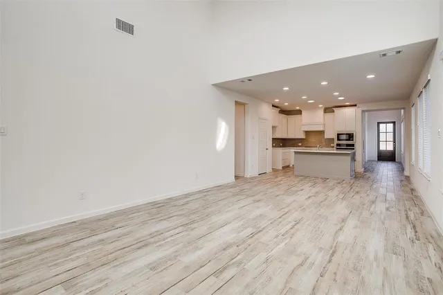 a view of kitchen with wooden floor