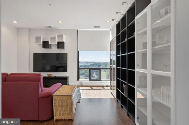 a living room with furniture and walk in closet