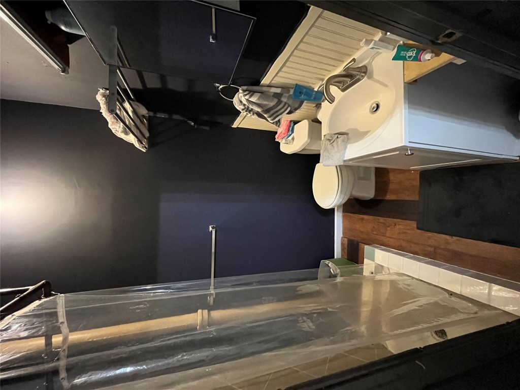 2511 East Cesar Chavez Street Austin, TX 78702 - Photo 18 of 21 a bathroom with a sink a toilet and shower