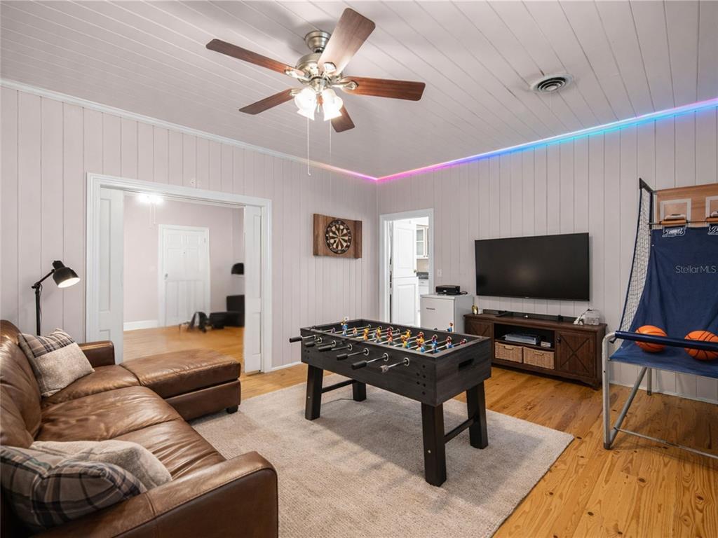 5915 Ave F McIntosh, FL 32664 - Photo 13 of 52 a living room with furniture and a flat screen tv