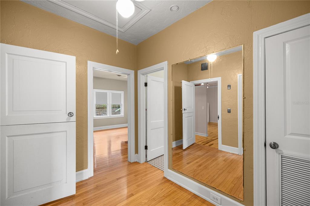 5915 Ave F McIntosh, FL 32664 - Photo 16 of 52 a view of a hallway with wooden floor and closet area