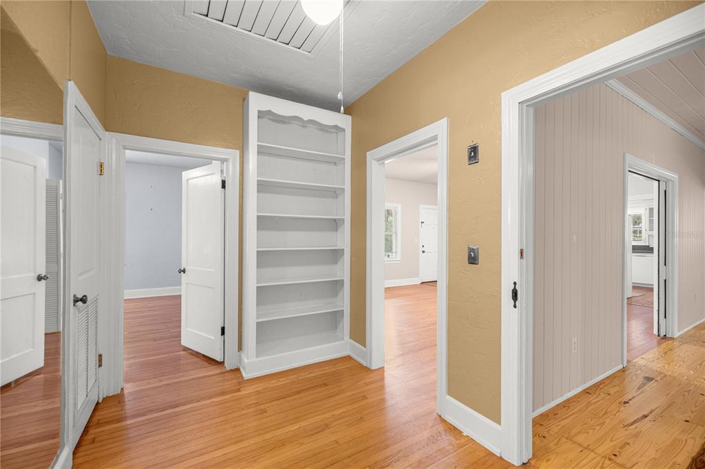 5915 Ave F McIntosh, FL 32664 - Photo 22 of 50 a view of a hallway with wooden floor and closet area