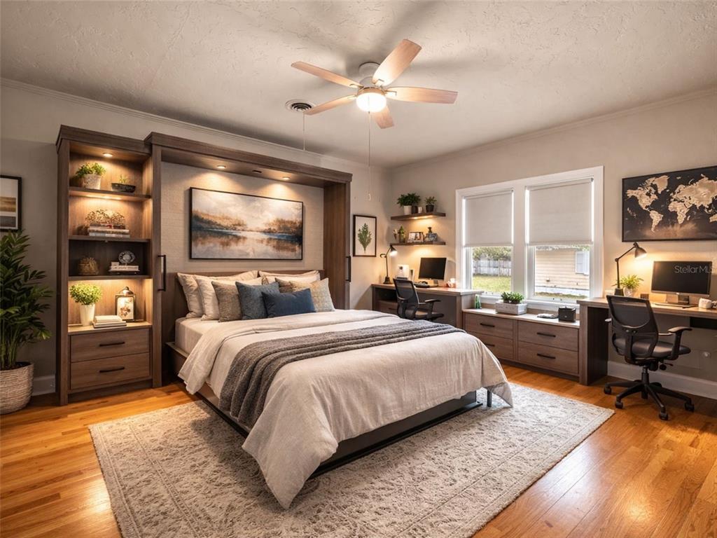 5915 Ave F McIntosh, FL 32664 - Photo 22 of 52 a bedroom with a large bed and a tv