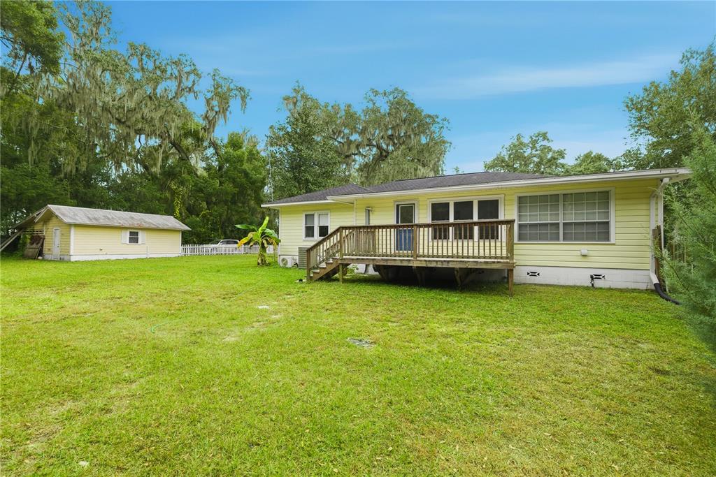 5915 Ave F McIntosh, FL 32664 - Photo 32 of 52 a view of a house with a backyard and a patio