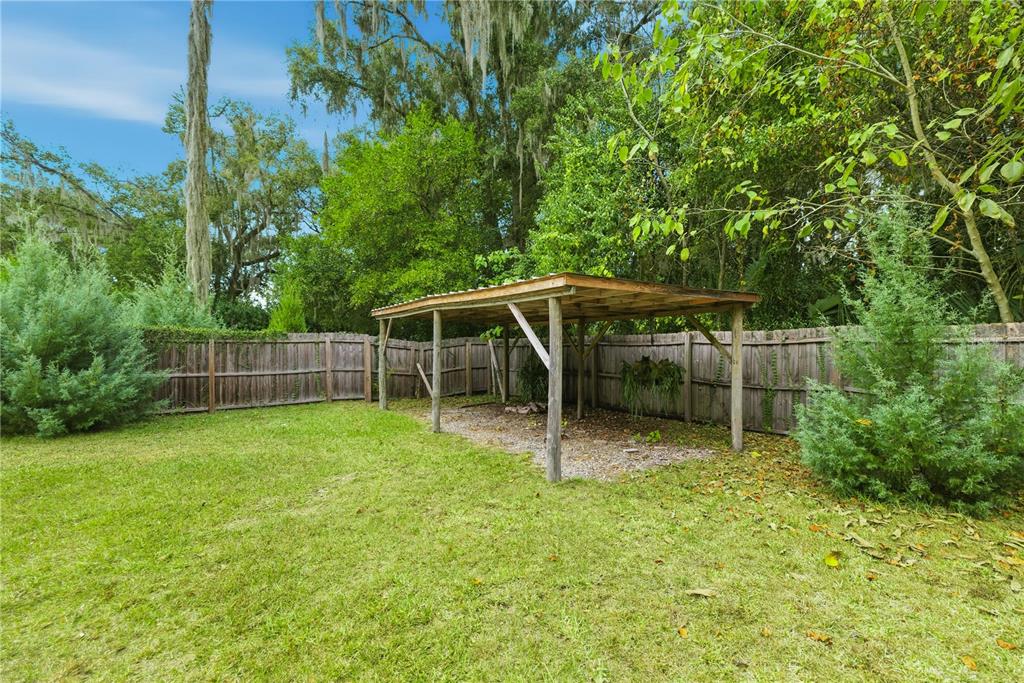 5915 Ave F McIntosh, FL 32664 - Photo 40 of 50 a view of backyard with trampoline