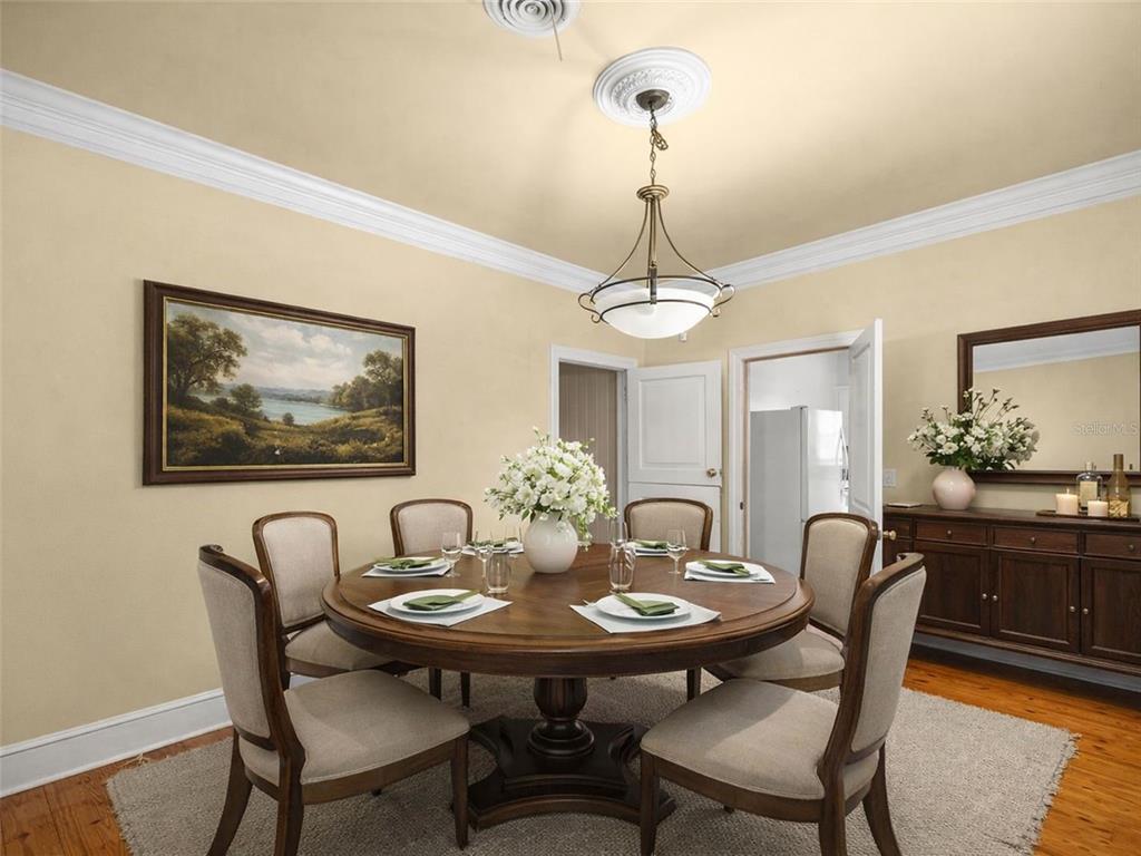 5915 Ave F McIntosh, FL 32664 - Photo 8 of 52 a view of a dining room with furniture wooden floor and a chandelier
