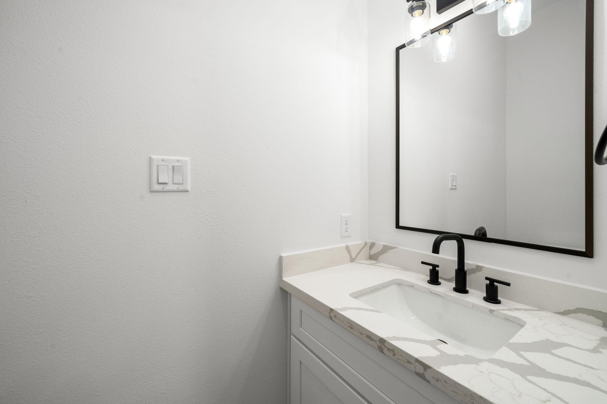 5514 Hardy Street Houston, TX 77009 - Photo 14 of 30 a bathroom with a sink and a mirror