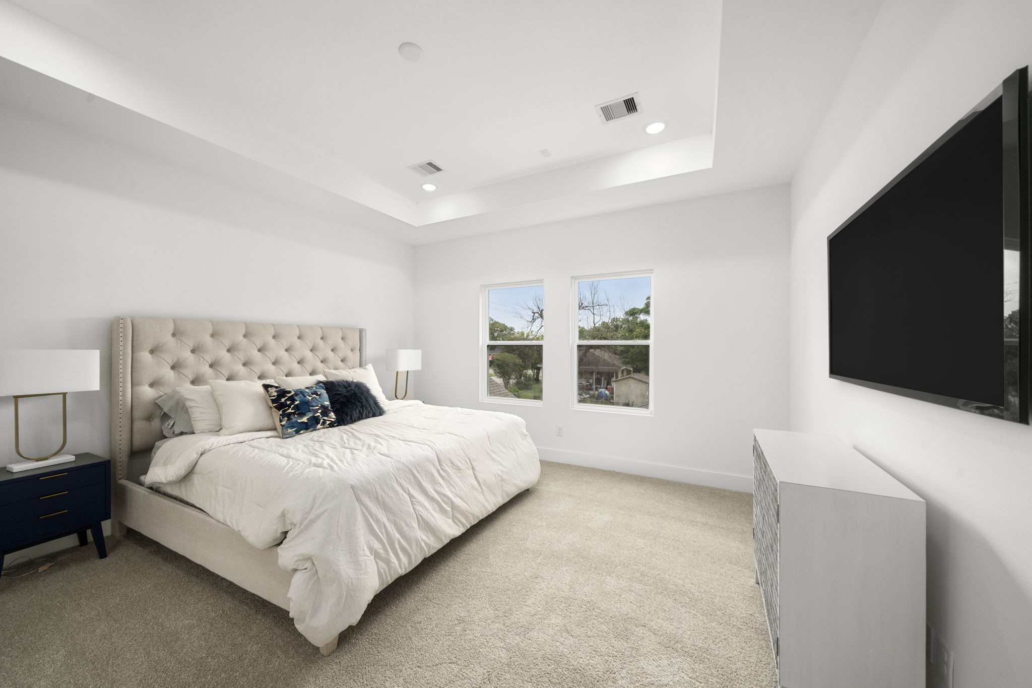 5514 Hardy Street Houston, TX 77009 - Photo 15 of 30 a bedroom with a bed and a flat screen tv