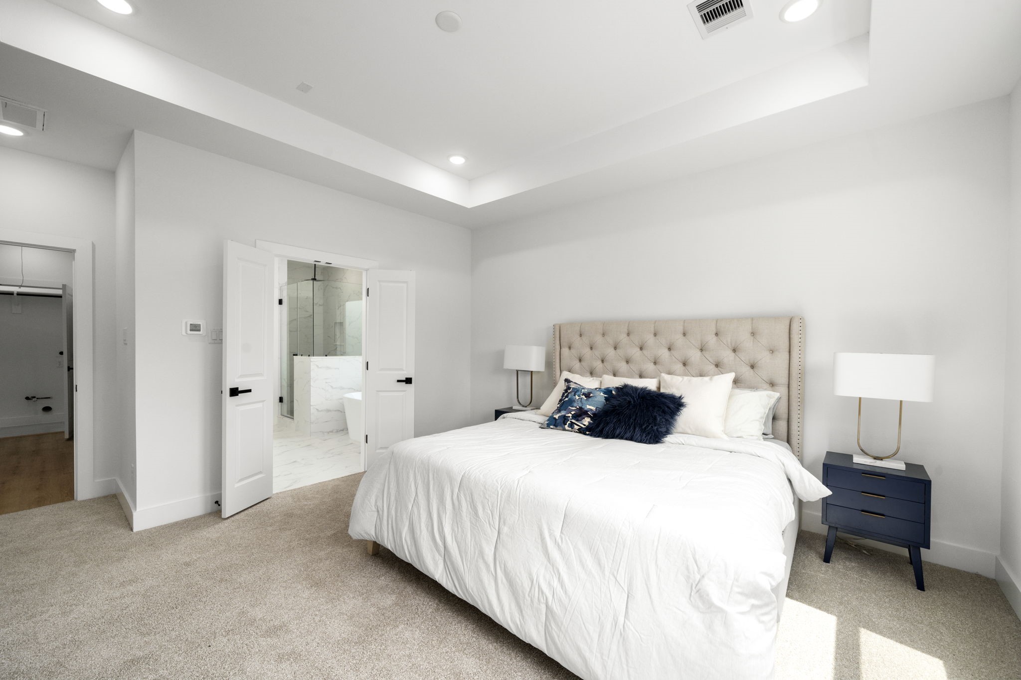 5514 Hardy Street Houston, TX 77009 - Photo 16 of 30 a bedroom with a bed and a lamp