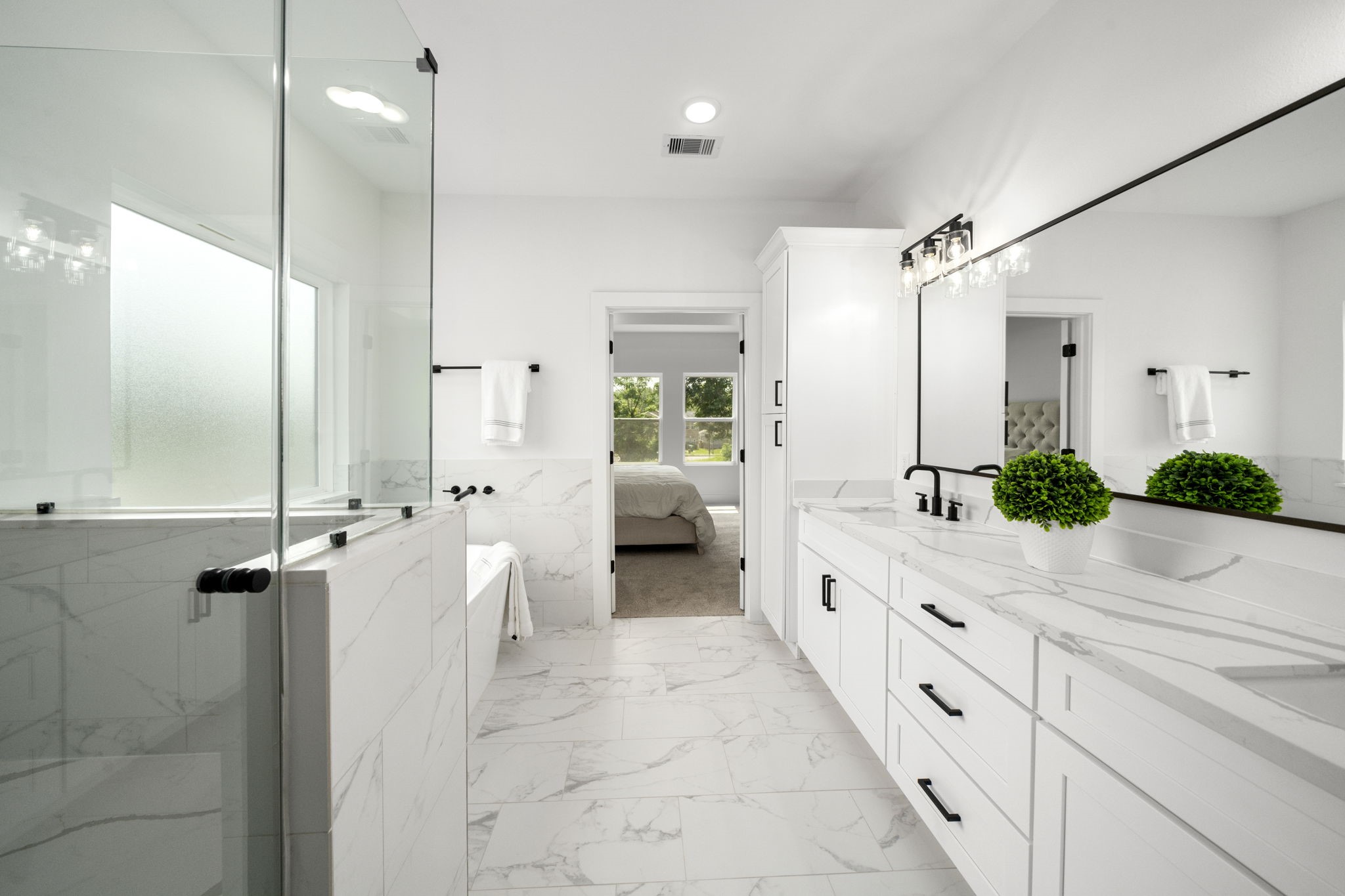 5514 Hardy Street Houston, TX 77009 - Photo 18 of 30 a large white bathroom with a large mirror and shower