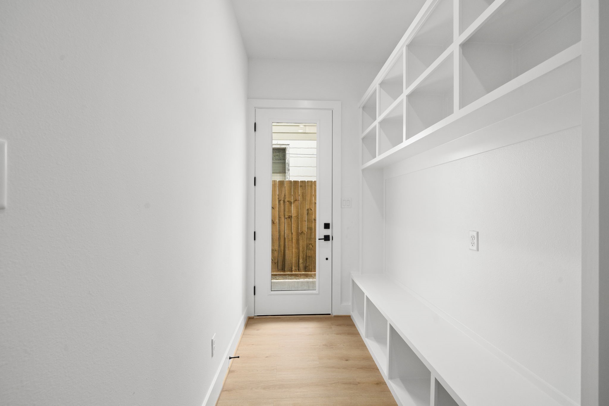 5514 Hardy Street Houston, TX 77009 - Photo 4 of 30 a view of a hallway with wooden floor