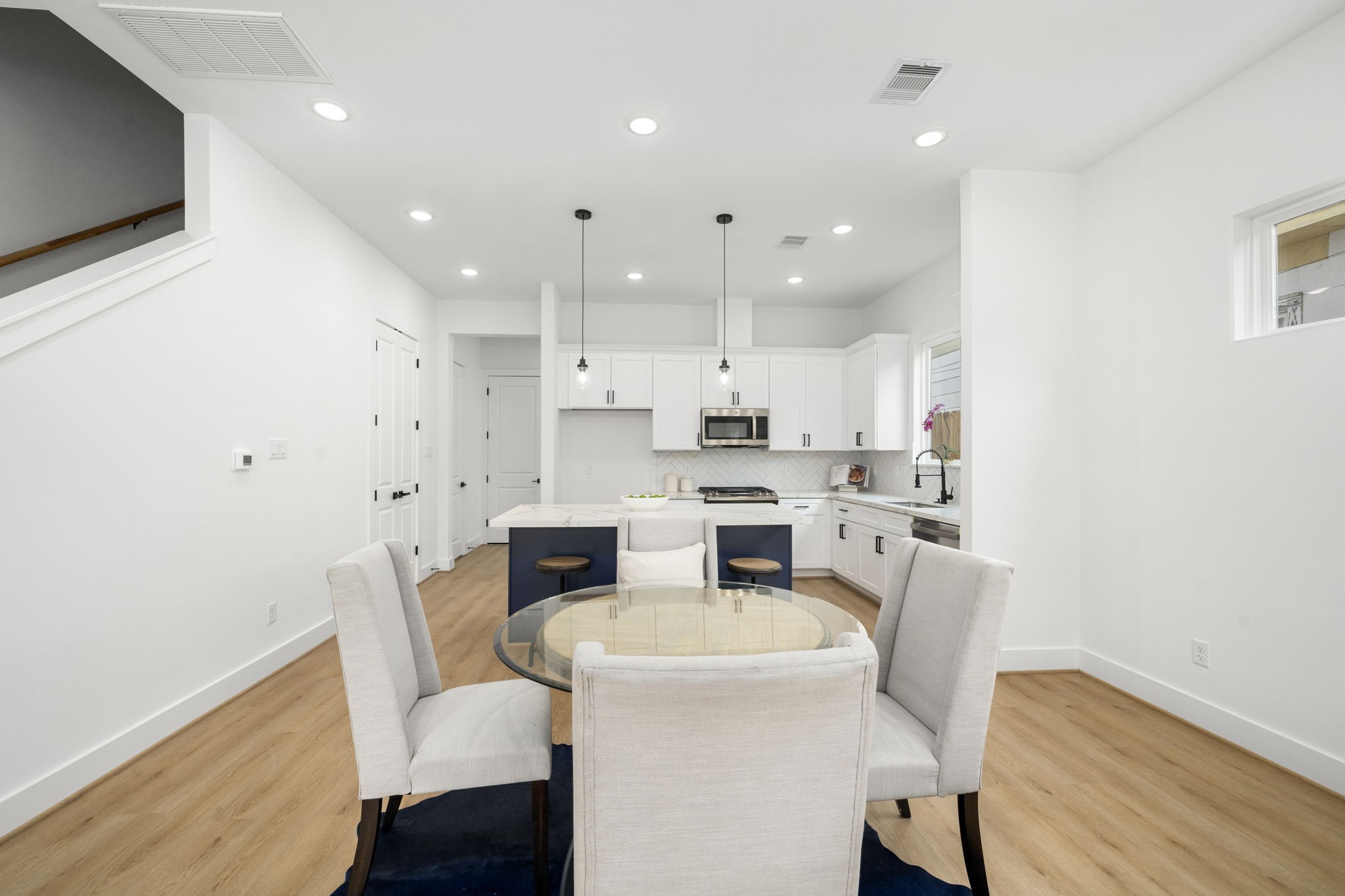 5514 Hardy Street Houston, TX 77009 - Photo 9 of 30 a large kitchen with cabinets table and chairs