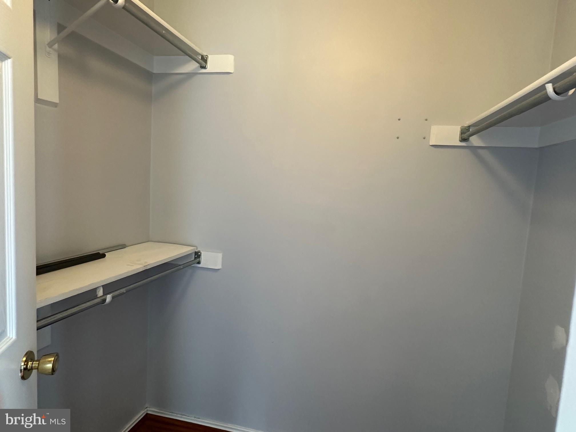 20950 Timber Ridge Terrace, Unit 201 Ashburn, VA 20147 - Photo 17 of 20 a view of a room with racks on the wall