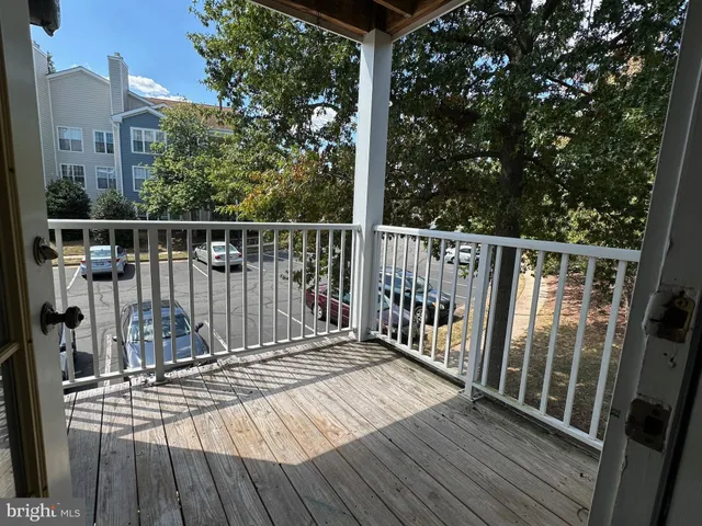 a view of balcony with wooden floor