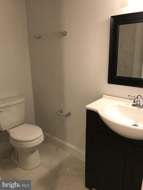 4537 Marble Hall Road Baltimore, MD 21239 - Photo 8 of 14 a bathroom with a sink and a toilet
