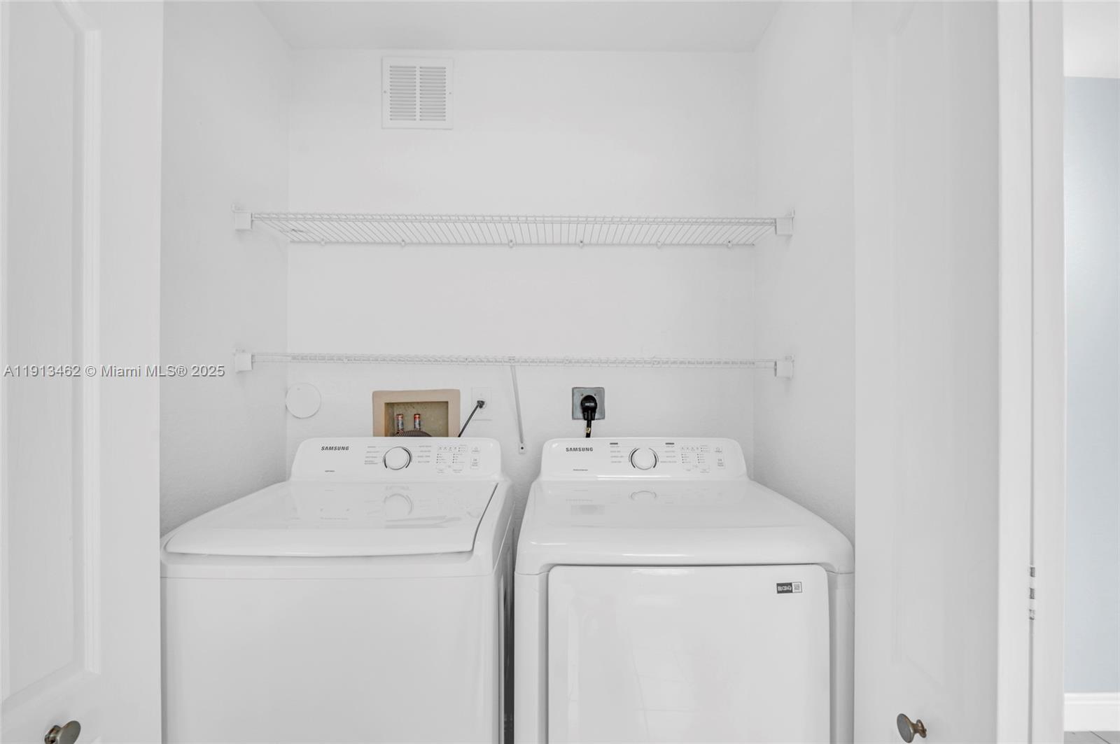 3197 Southwest 128th Way, Unit 135 Miramar, FL 33027 - Photo 13 of 35 a utility room with dryer and washer