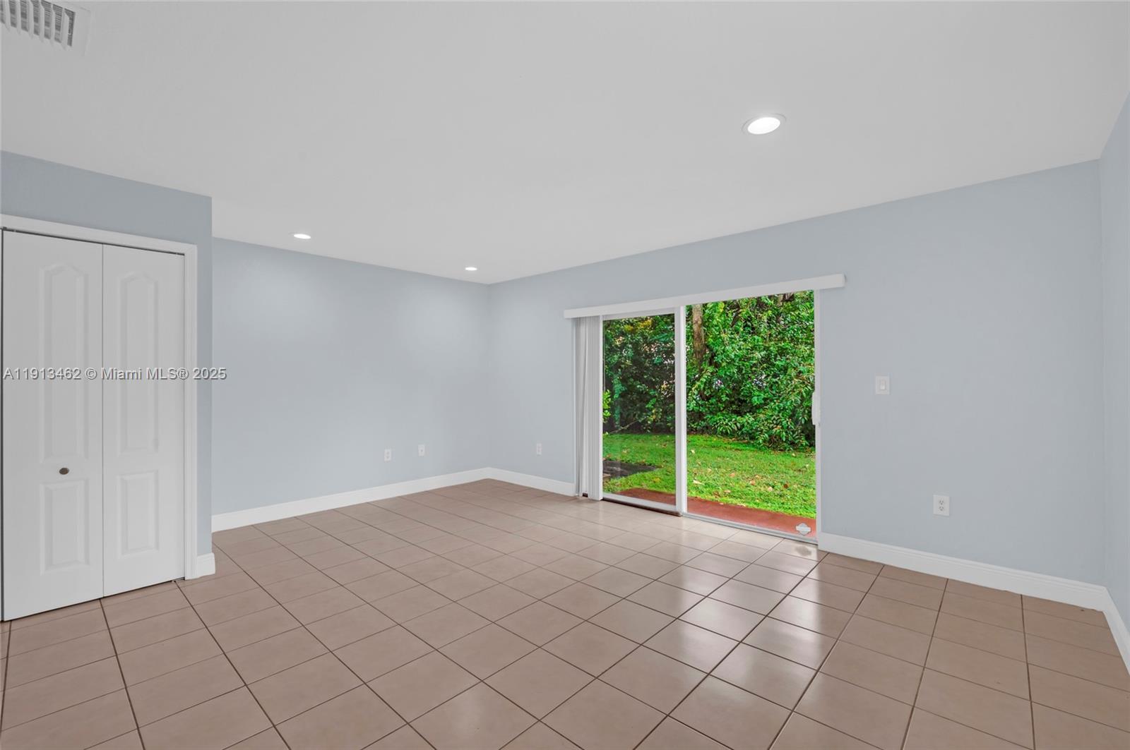 3197 Southwest 128th Way, Unit 135 Miramar, FL 33027 - Photo 14 of 35 a view of an empty room with a window