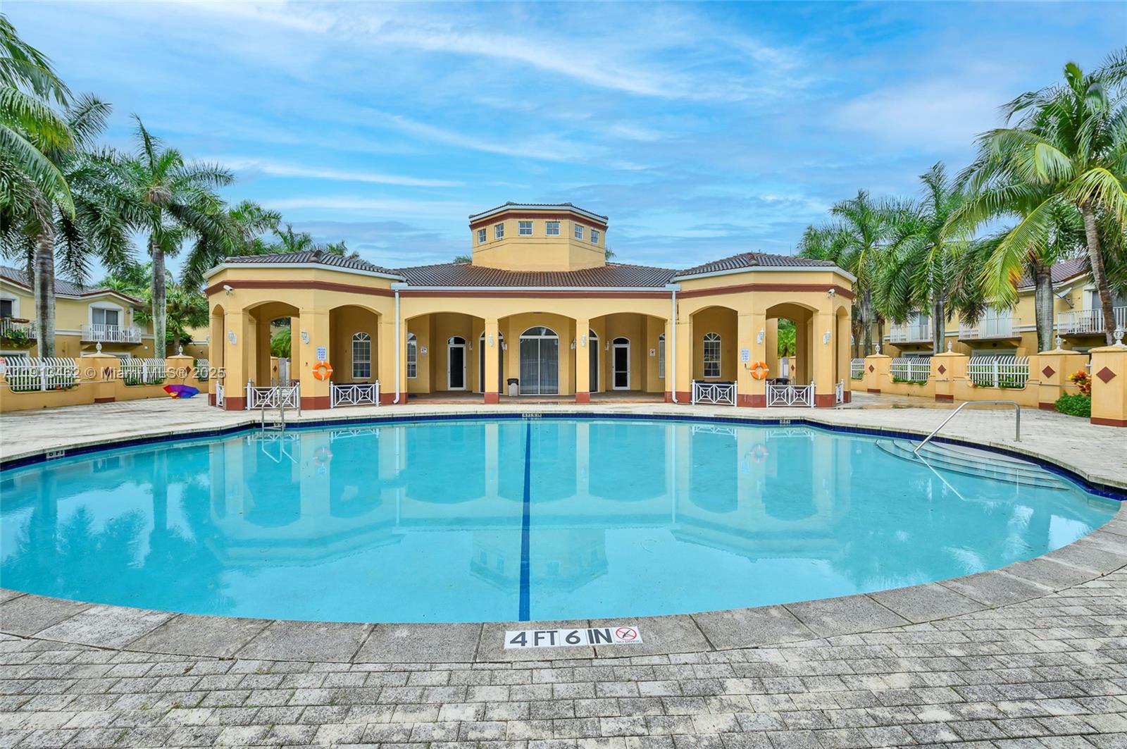 3197 Southwest 128th Way, Unit 135 Miramar, FL 33027 - Photo 27 of 35 a view of a house with a swimming pool
