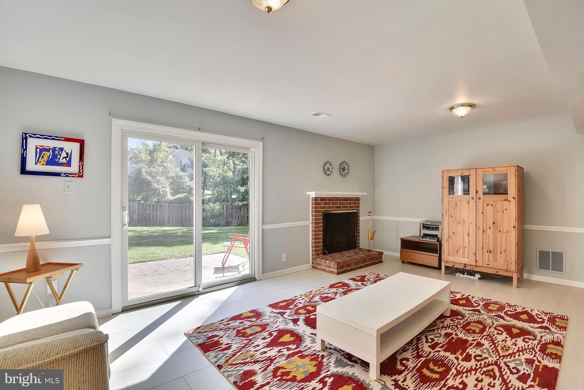 9 Treworthy Road Gaithersburg, MD 20878 - Photo 24 of 30 Rec Room w/ glass slider to patio & yard