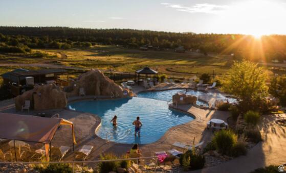 793 South Zion Road Orderville, UT 84758 - Photo 9 of 12 Expansive outdoor pool area featuring a freeform swimming pool, integrated hot tub, and rock features