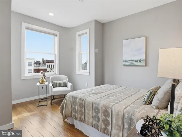 a bedroom with a bed and a chair