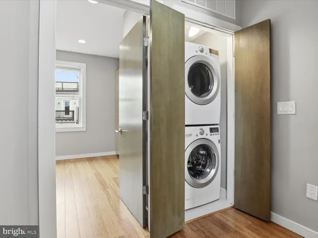 a view of a hallway with washer and dryer