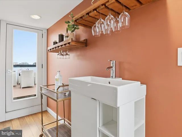a bathroom with a sink a mirror and a shower