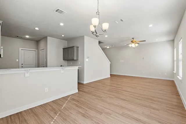 wooden floor in an empty room with a mirror