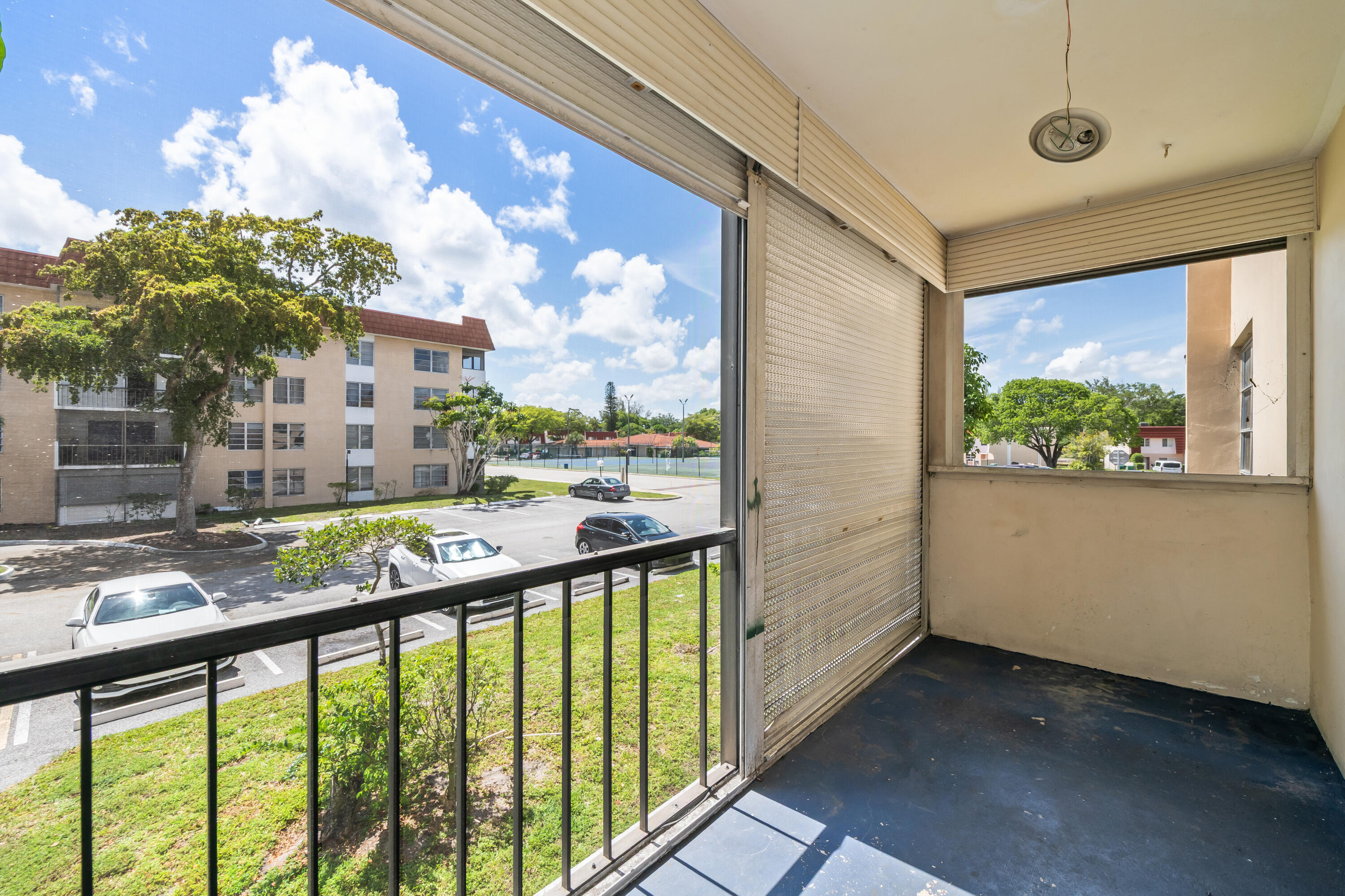 4156 Inverrary Drive, Unit 210 Lauderhill, FL 33319 - Photo 26 of 27 a view of balcony with a lot of flower plants