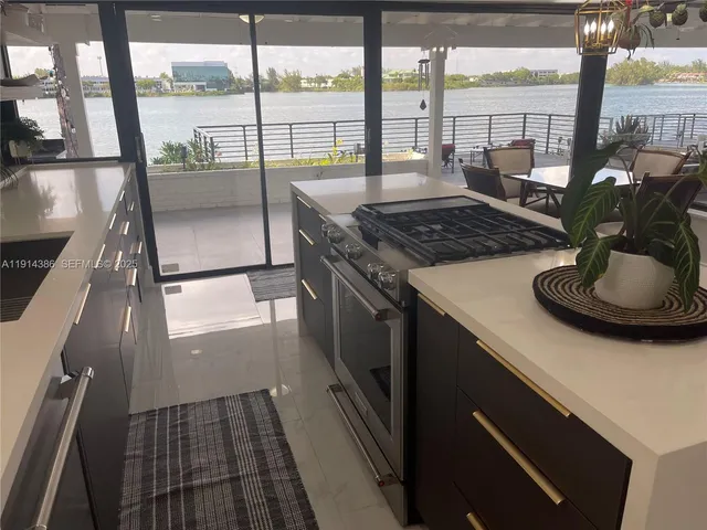 a kitchen with a sink and a stove