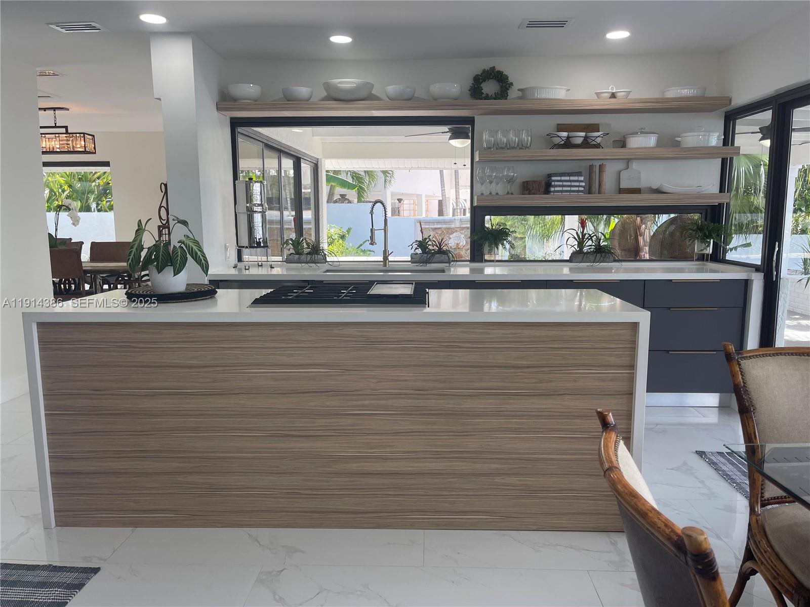 7521 Southwest 56th Street Miami, FL 33155 - Photo 19 of 34 a bathroom with a sink and a large mirror