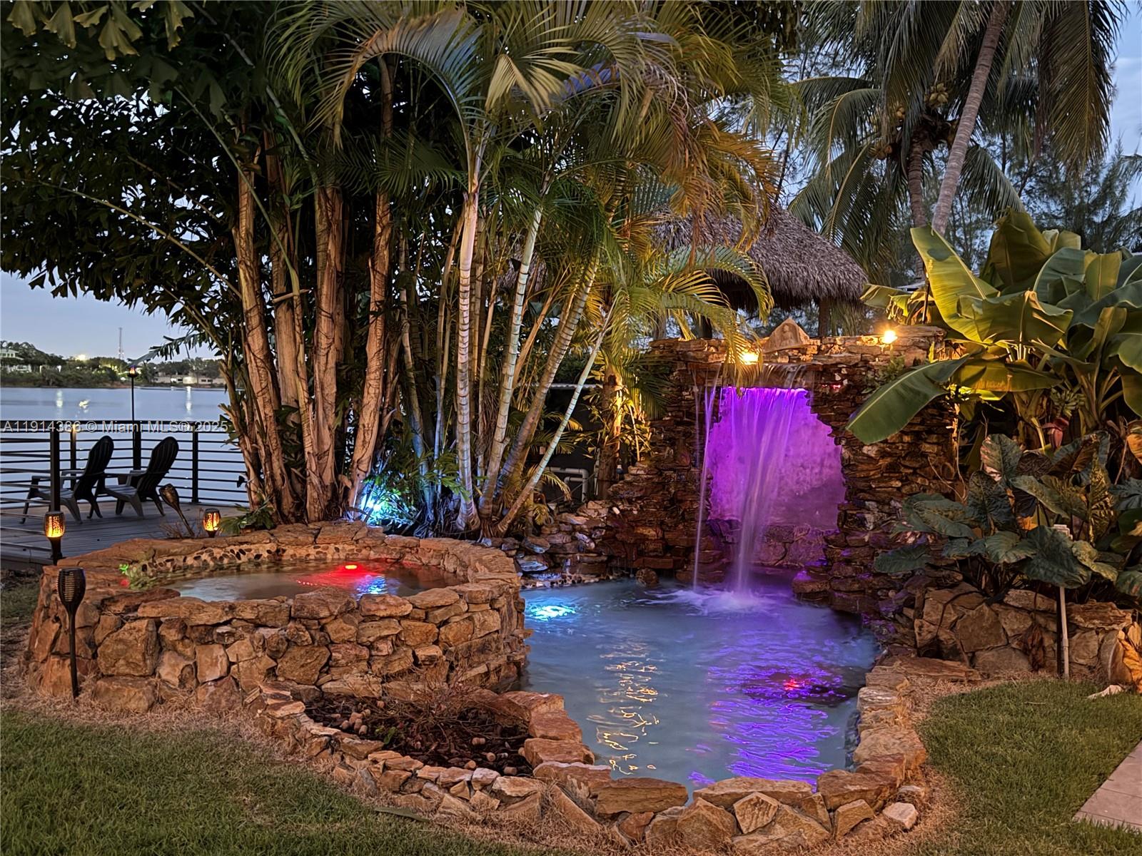 7521 Southwest 56th Street Miami, FL 33155 - Photo 2 of 34 a backyard of a house with barbeque oven table and chairs