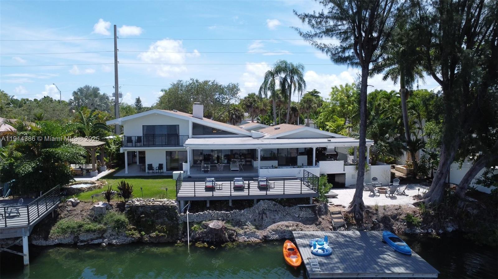 7521 Southwest 56th Street Miami, FL 33155 - Photo 25 of 34 a view of a swimming pool and lounge chairs in patio