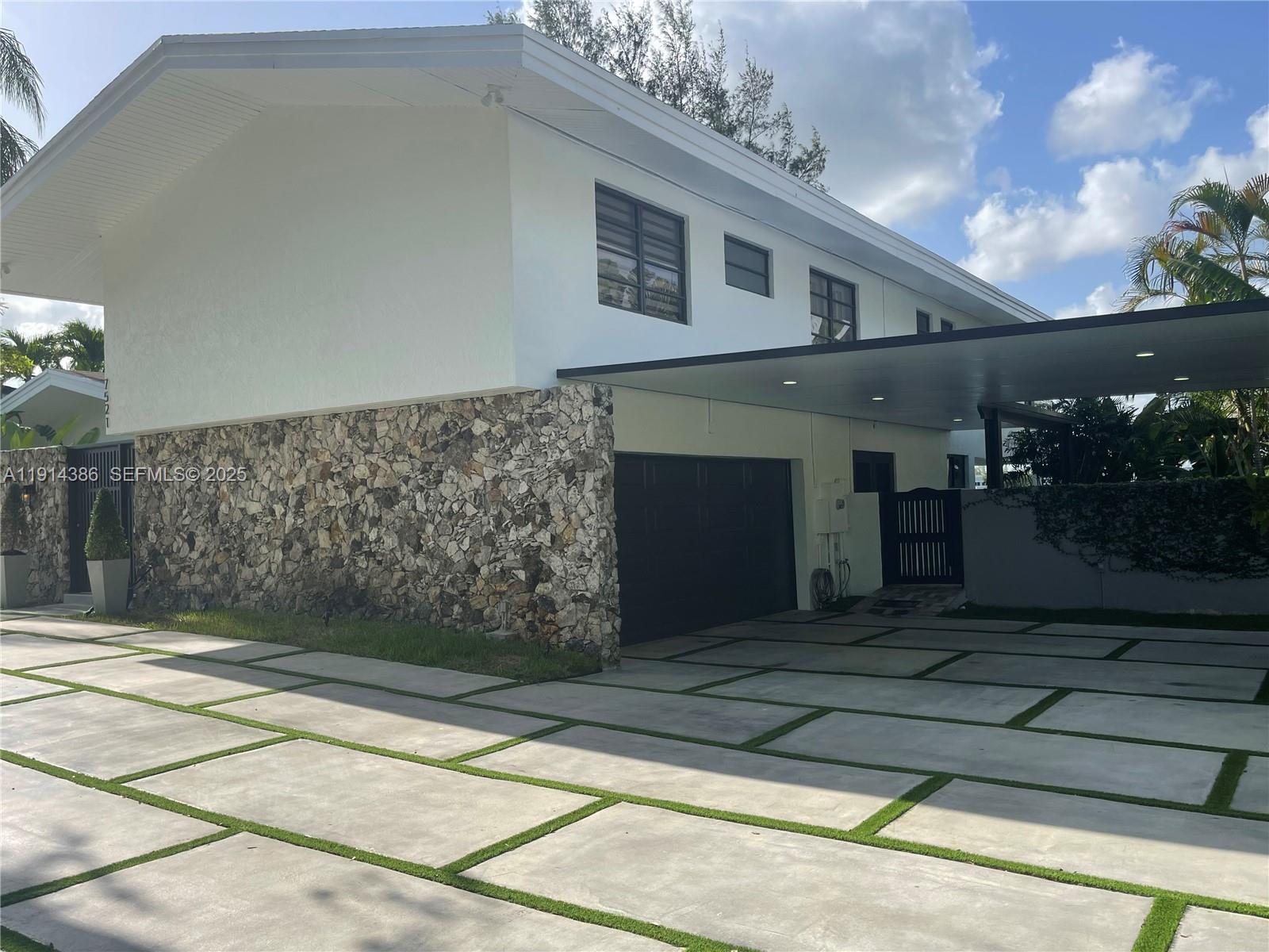 7521 Southwest 56th Street Miami, FL 33155 - Photo 29 of 34 a front view of a house with yard