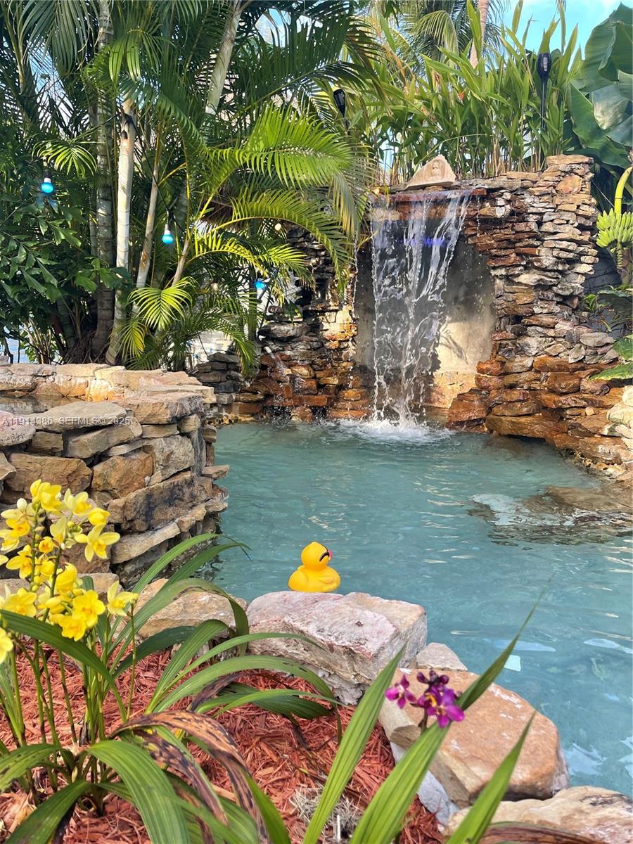 7521 Southwest 56th Street Miami, FL 33155 - Photo 34 of 34 a lake view with boat and palm trees