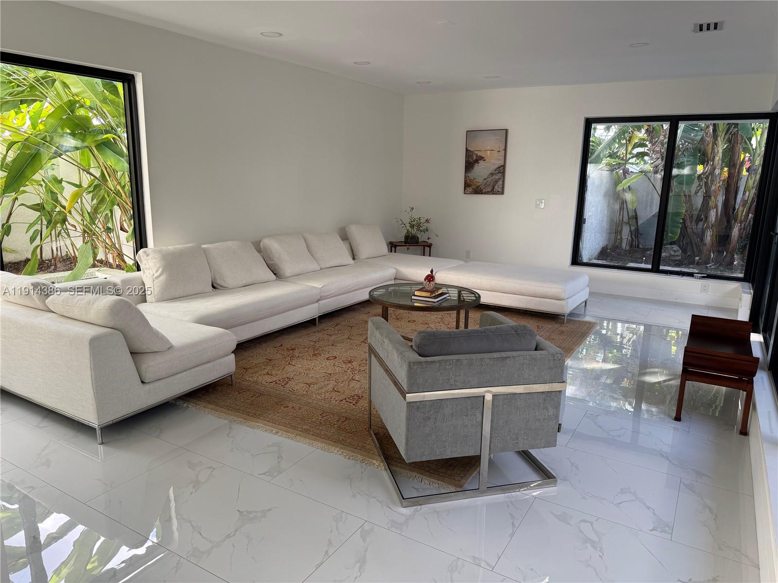 7521 Southwest 56th Street Miami, FL 33155 - Photo 7 of 34 a living room with furniture and a large window