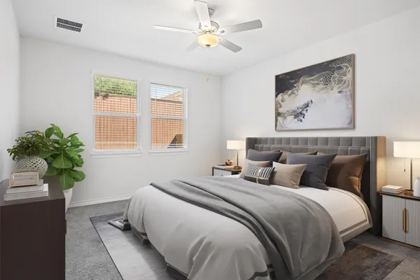 an empty room with a window and a ceiling fan