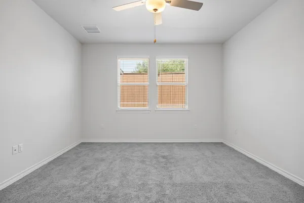 an empty room with a bathroom