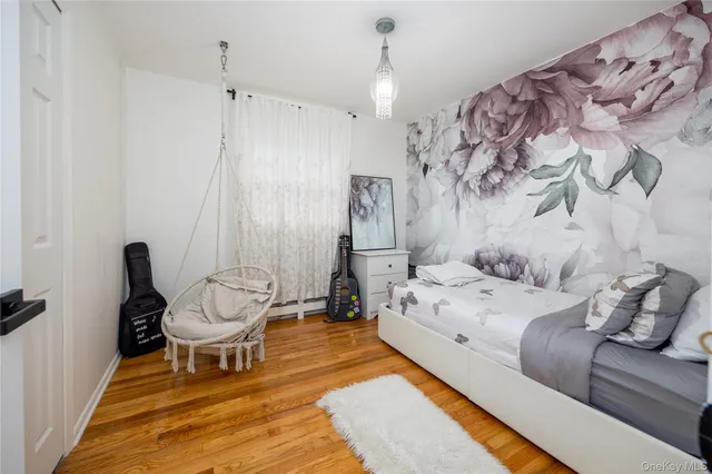 a bed room with a bed and a chair