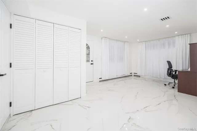 a view of a livingroom with natural light