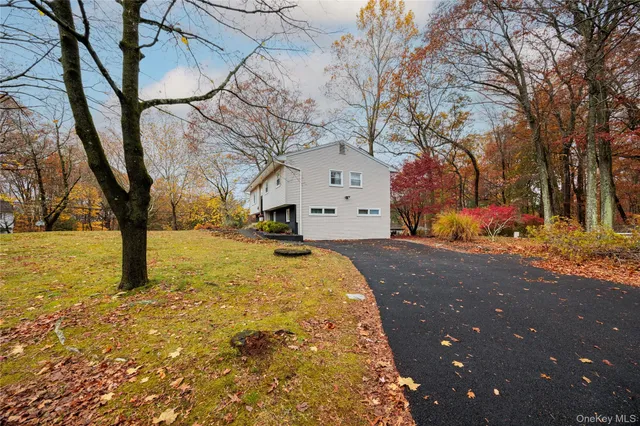 a view of large tree in front of house