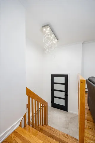 a view of a hallway with staircase