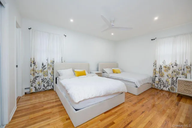 a view of bedroom with furniture and wooden floor
