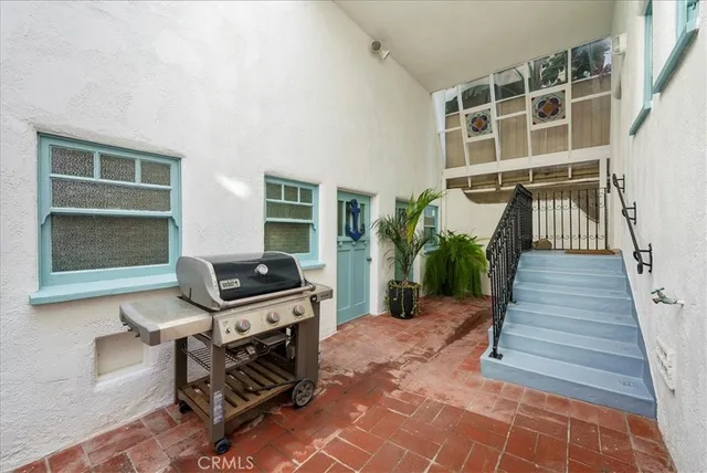 a room with water heater and a wooden shelves