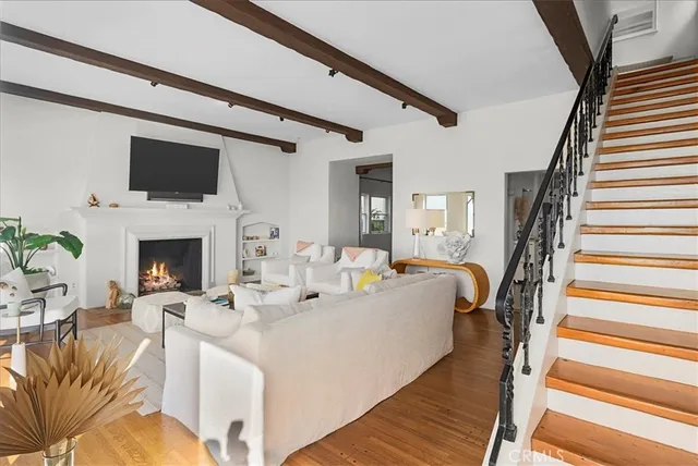 a living room with furniture fireplace and a flat screen tv