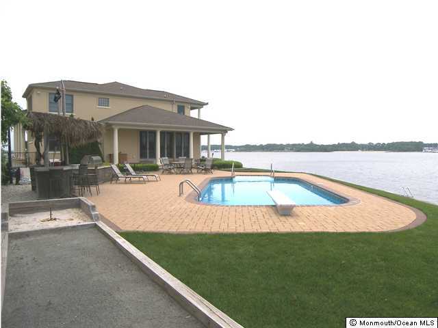 16 Dock Road Brick, NJ 08723 - Photo 2 of 3 a view of a house with swimming pool and porch