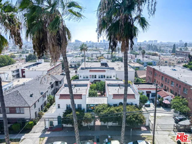 a view of a city with palm trees