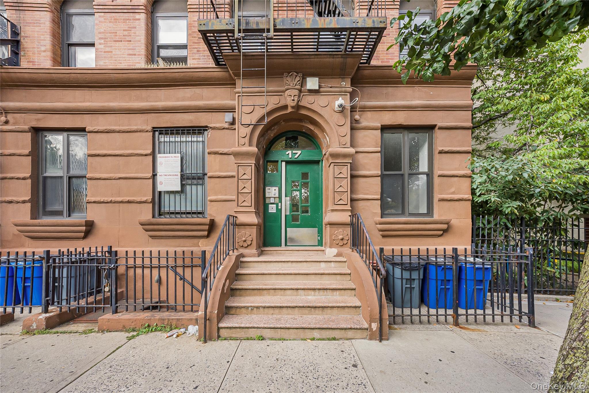 17 East 131st Street, Unit 1A Manhattan, NY 10037 - Photo 1 of 14 a front view of a house with a iron gate